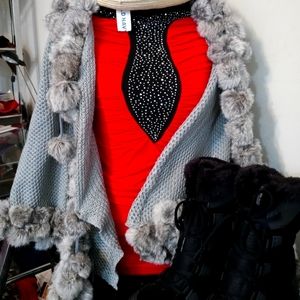 Both red dress and, Gray sweater.